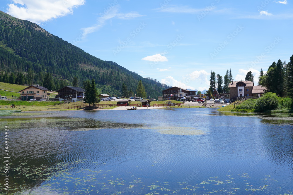 Fototapeta premium lake at the lavaze pass. Lavaze Pass in South Tyrol, Bolzano Province: is one of the most fascinating landscapes of Val di Fiemme. Trentino Alto Adige. Dolomiti, northern Italy.