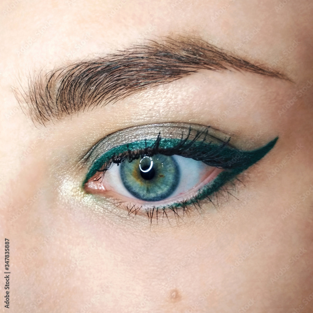 Foto Stock Blue eye gold green arrow eyeliner make-up eyebrow lash cosmetic  swatch fashion macro photo | Adobe Stock