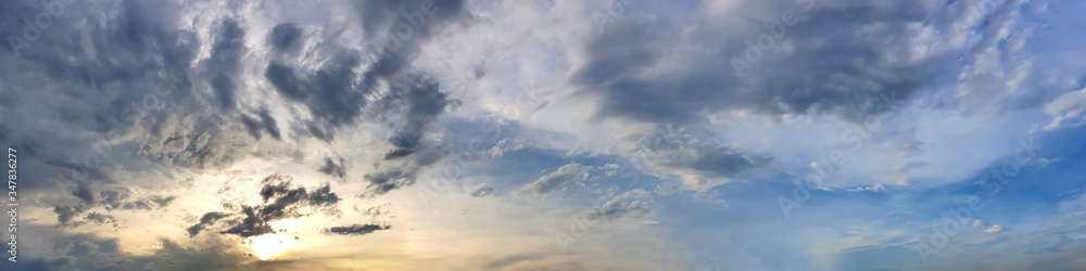Fototapeta premium Blue sky panorama with storm cloud on a cloudy day. Beautiful 180 degree panoramic image.