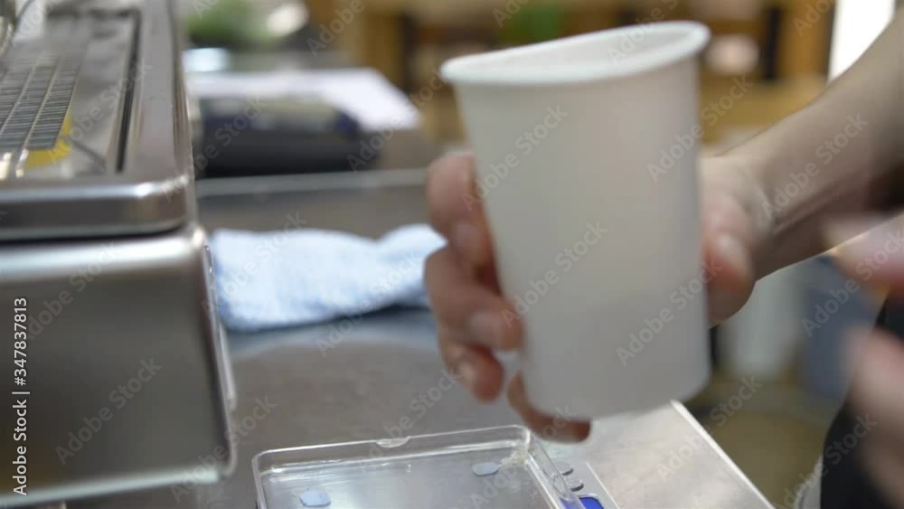 woman pouring out the coffee powder of paper cup - static woman pouring out the coffee powder of paper cup - static