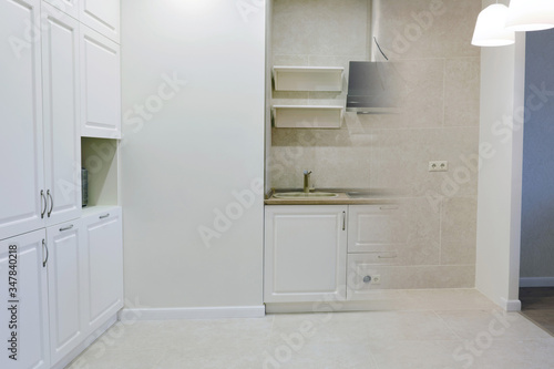 Comparison of a small kitchen room in an apartment before and after renovation new house  close up. Beautiful custom kitchen design and photo combination before furniture installation and after