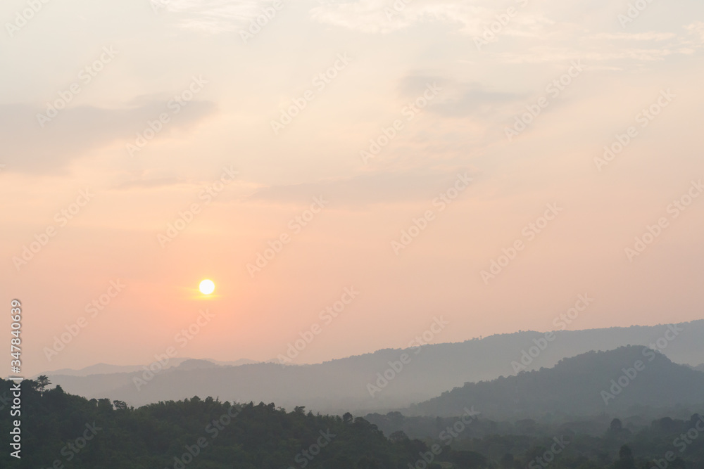 Sunset scene with silhouette mountain at Khun Dan Prakan Chon Dam