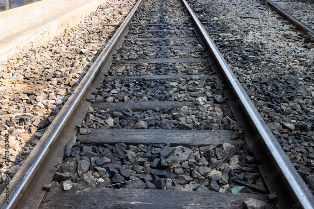 Fototapeta premium Railway line track. in train station. vintage transportation. way to travel.