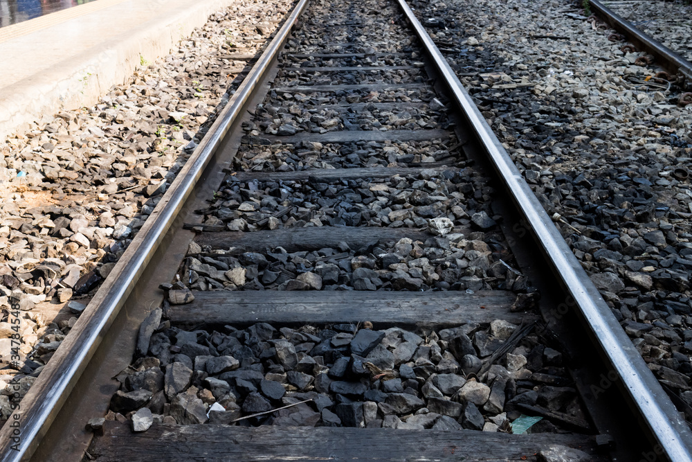 Fototapeta premium Railway line track. in train station. vintage transportation. way to travel.