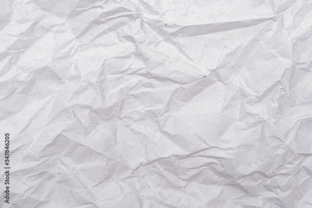 White crumpled paper texture. Abstract paper pattern for background. Close-up. White crumpled paper texture. Abstract paper pattern for background. Close-up.