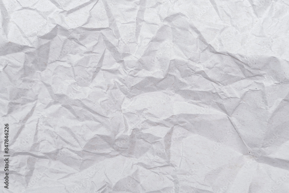 White crumpled paper texture. Abstract paper pattern for background. Close-up. White crumpled paper texture. Abstract paper pattern for background. Close-up.