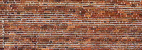 Old red Brick wall background. Wide panoramic view of masonry