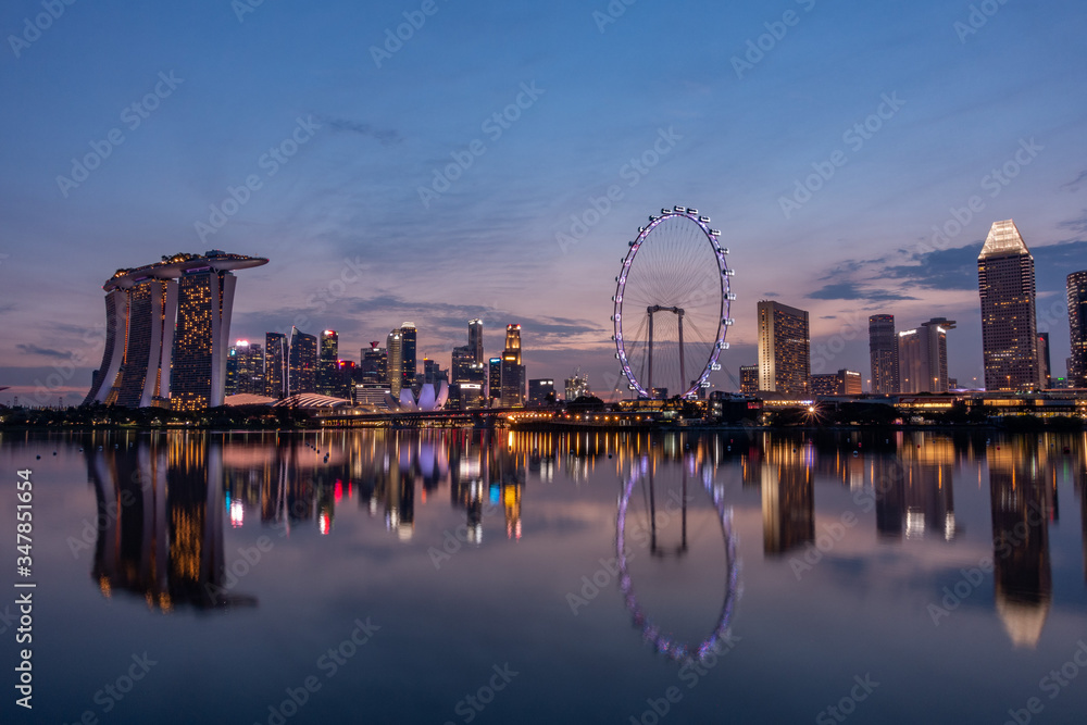 Wide panorama image of Singapore skyscrapers at magic hour