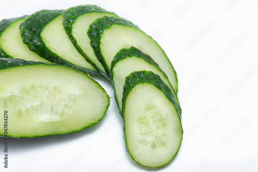 Sliced ​​single cucumber on a white background