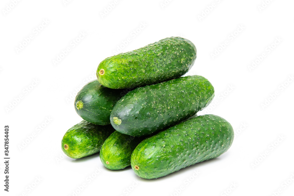 A lot of cucumbers on a white background. Six cucumbers A lot of cucumbers on a white background. Six cucumbers