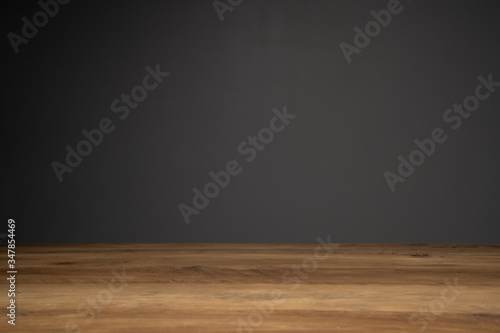 top of wooden table and dark background with copy space.