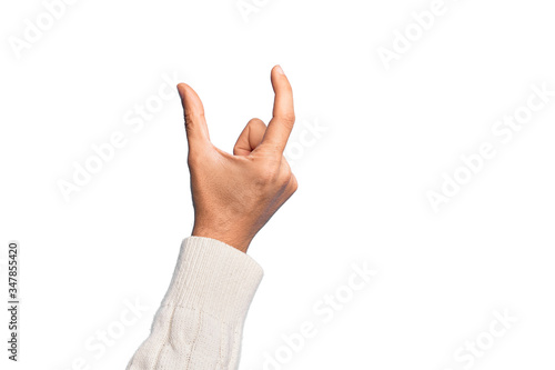 Hand of caucasian young man showing fingers over isolated white background picking and taking invisible thing, holding object with fingers showing space