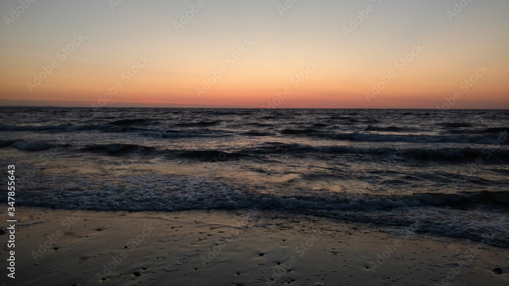 an image of sunset over baltic sea