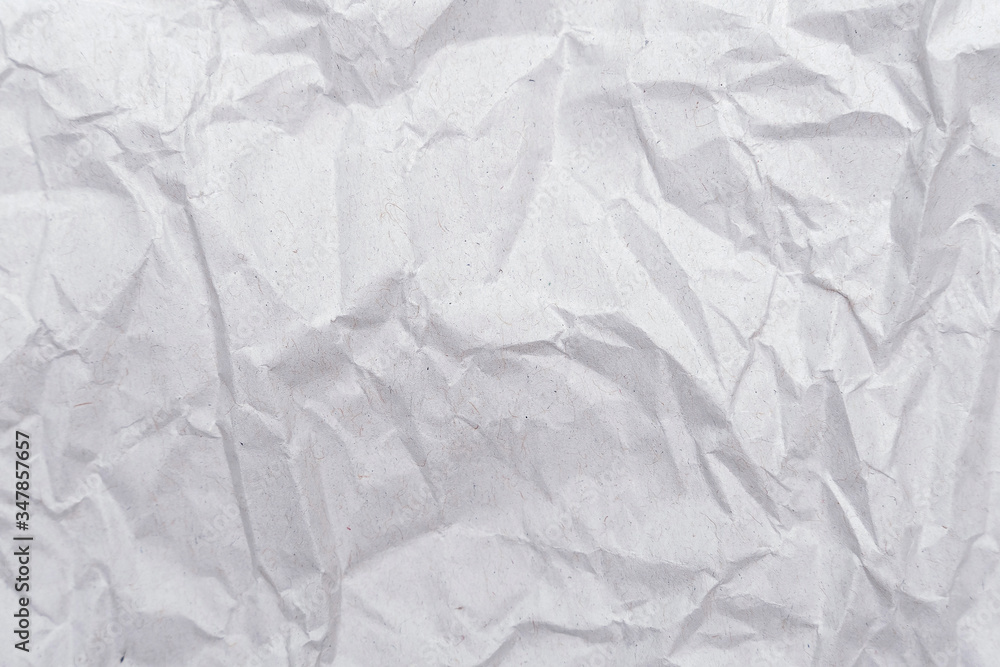 Naklejka premium White crumpled paper texture. Abstract paper pattern for background. Close-up.