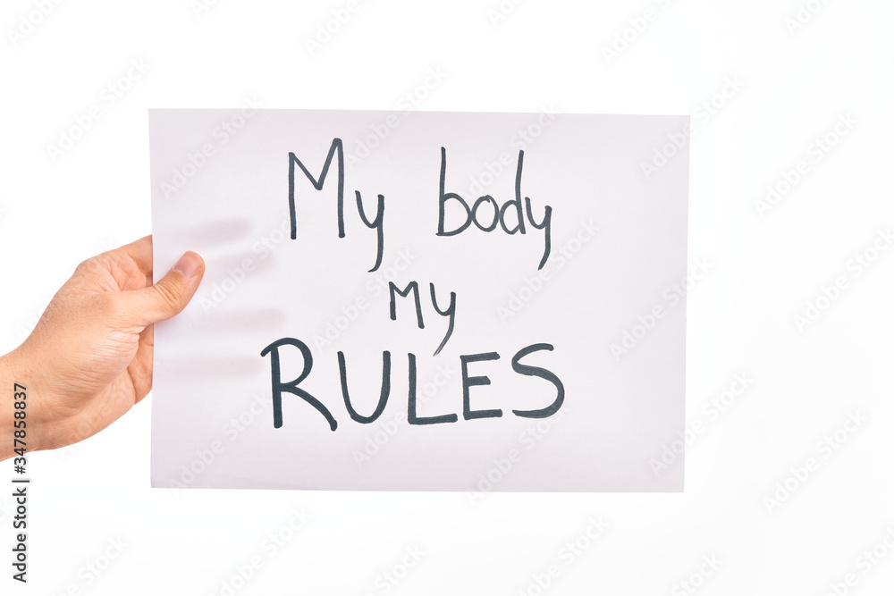 Cardboard banner with MY BODY MY RULES asking for body rights over isolated white background Cardboard banner with MY BODY MY RULES asking for body rights over isolated white background