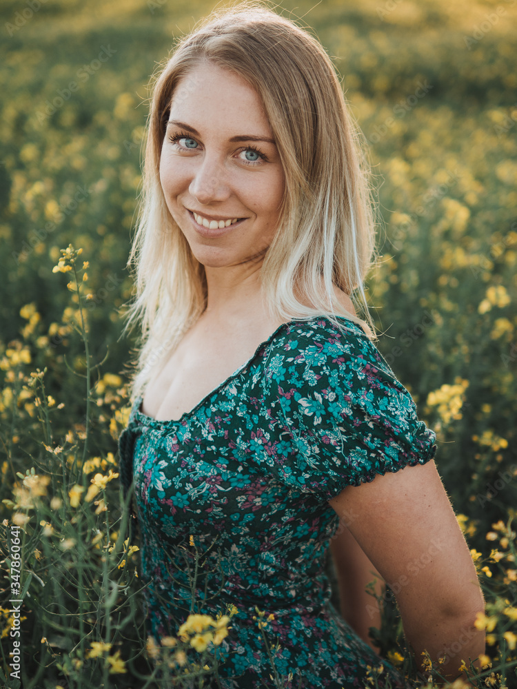 Young woman at rapeseed field Young woman at rapeseed field