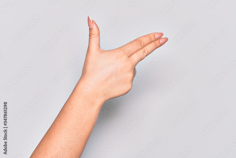 Hand of caucasian young woman gesturing fire gun weapon with fingers, aiming shoot symbol Hand of caucasian young woman gesturing fire gun weapon with fingers, aiming shoot symbol