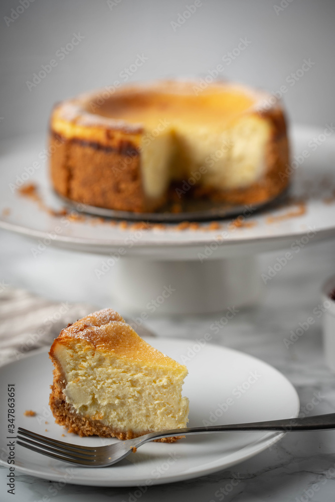 new york style cheesecake on marble background new york style cheesecake on marble background