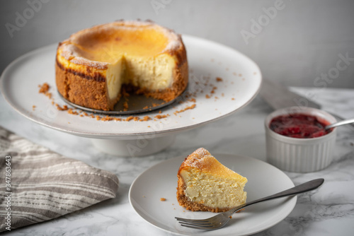 new york style cheesecake on marble background