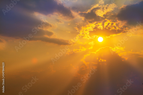 Sunset or sunrise with cloud and ray light on blue sky and other atmospheric effect