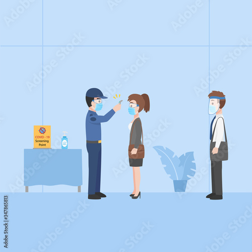 A security guard measures the temperature of People in business casual outfits social distance in New normal life wearing a surgical protective Medical mask and face shield for prevent coronavirus.
