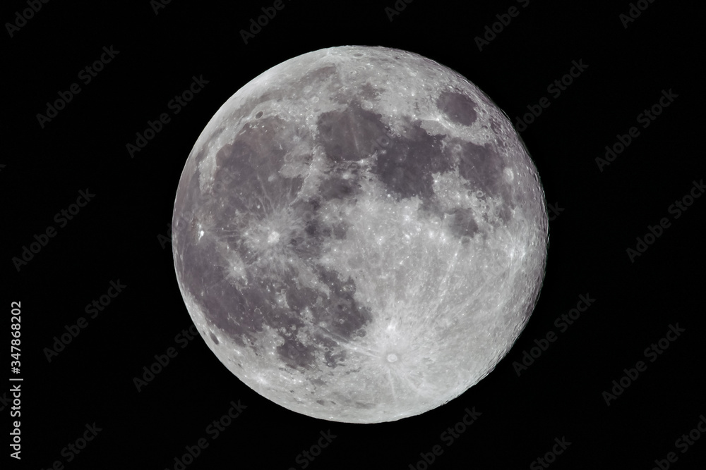 Full Moon in a dark sky.