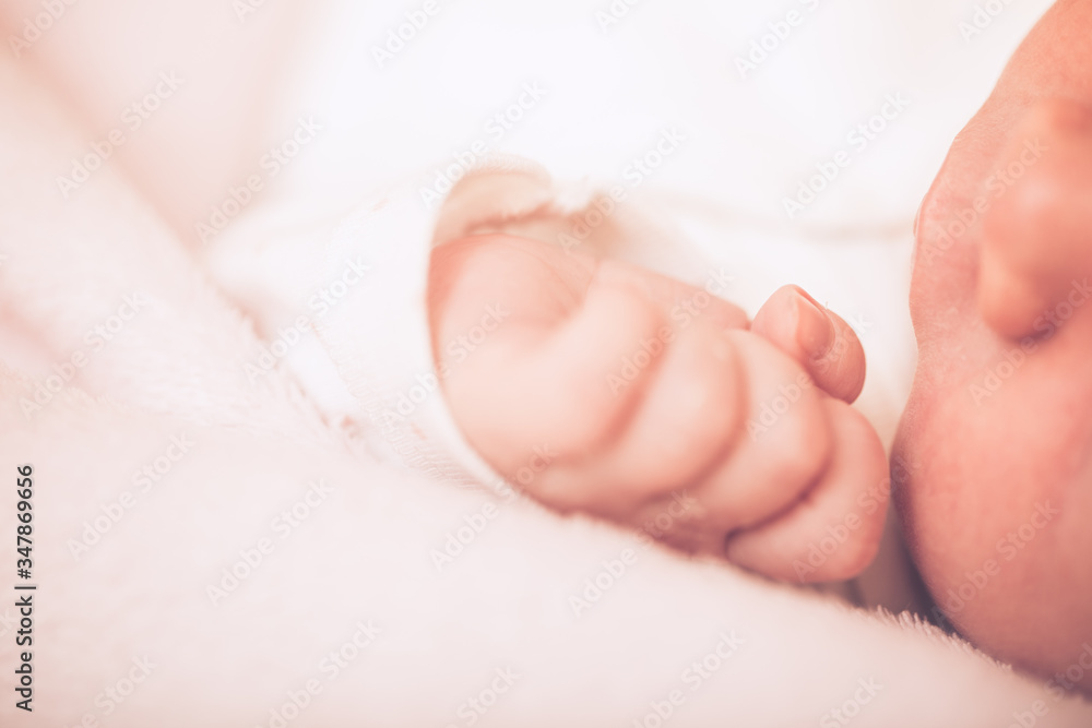 Newborn baby face close up shallow depth of field. Close-up beautiful sleeping baby girl. Newborn baby face close up shallow depth of field. Close-up beautiful sleeping baby girl.