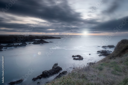 Sunset in Mendocino Headlands State Park  California  USA  with lens flare and long exposure  giving a sense of peace and tranquility