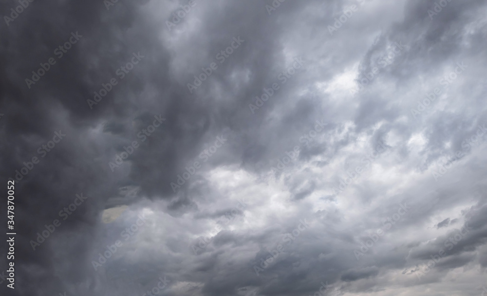 Dark storm clouds before rain used for climate background. Clouds become dark gray before raining. Dramatic background. Dark storm clouds before rain used for climate background. Clouds become dark gray before raining. Dramatic background.