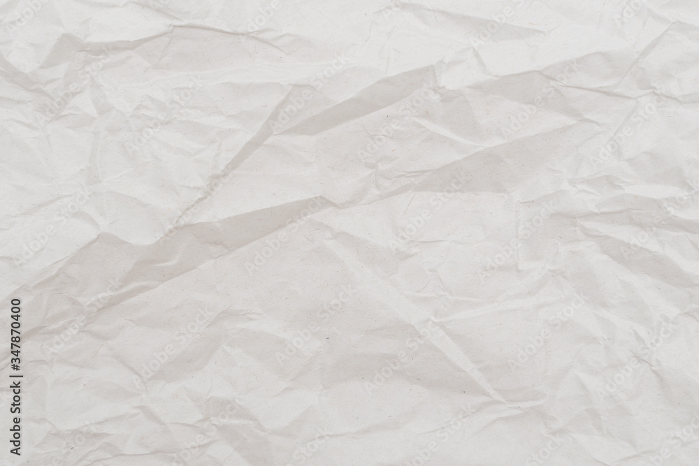 White crumpled paper texture. Abstract paper pattern for background. Close-up. White crumpled paper texture. Abstract paper pattern for background. Close-up.