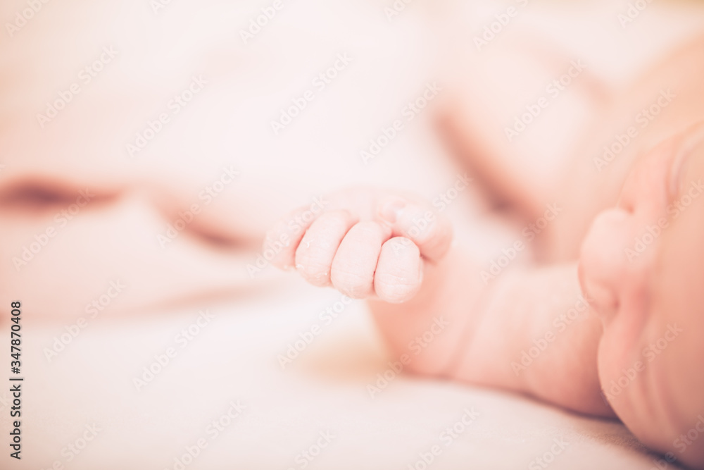 Adorable baby sleeping on stomach. Little hand of sleeping baby newborn close up. Adorable baby sleeping on stomach. Little hand of sleeping baby newborn close up.