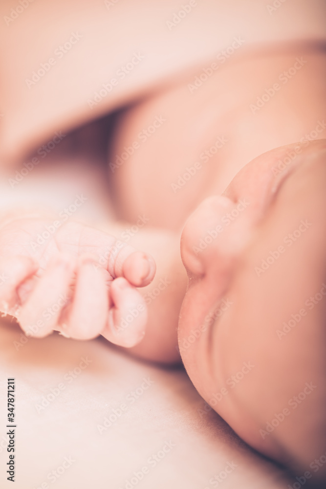 Adorable baby sleeping on stomach. Little hand of sleeping baby newborn close up. Adorable baby sleeping on stomach. Little hand of sleeping baby newborn close up.