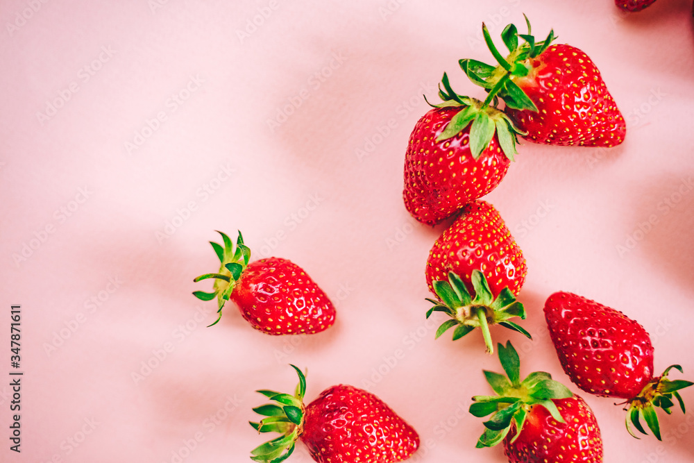 Fresh strawberry on the light pink background. View from above. Place for text. Fresh strawberry on the light pink background. View from above. Place for text.