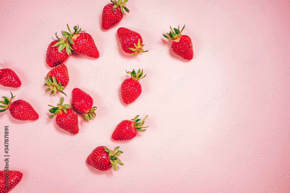 Fresh strawberry on the light pink background. View from above. Place for text. Fresh strawberry on the light pink background. View from above. Place for text.