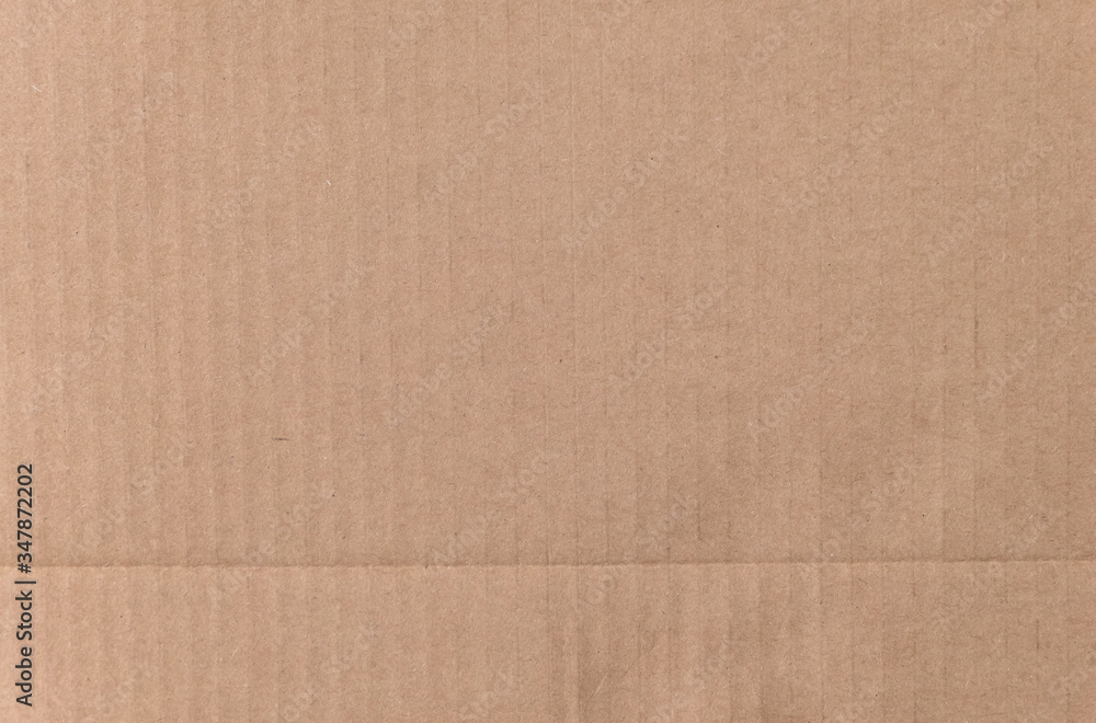Fototapeta premium Brown cardboard sheet texture background. Texture of recycle paper box in old vintage pattern background.