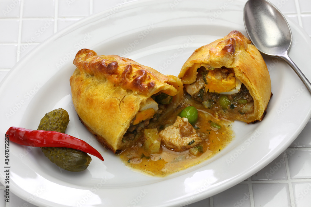 homemade saltena, empanada with a juicy filling, Bolivian breakfast homemade saltena, empanada with a juicy filling, Bolivian breakfast