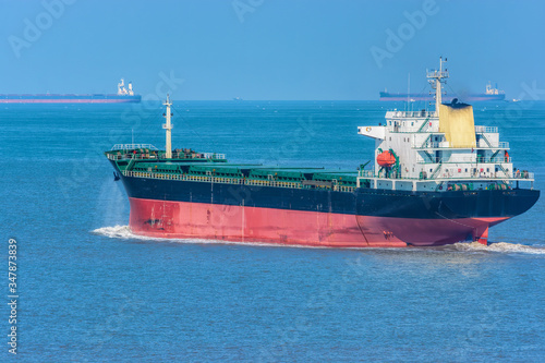Obraz na plátně Bulk carrier vessel in ballast underway at sunny day.