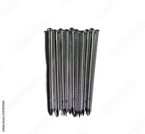 Konstfotografi Steel nails on white background. construction concept