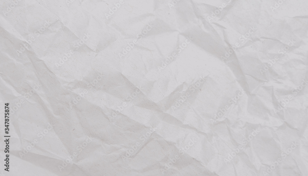 Fototapeta premium White crumpled paper texture. Abstract paper pattern for background. Close-up.