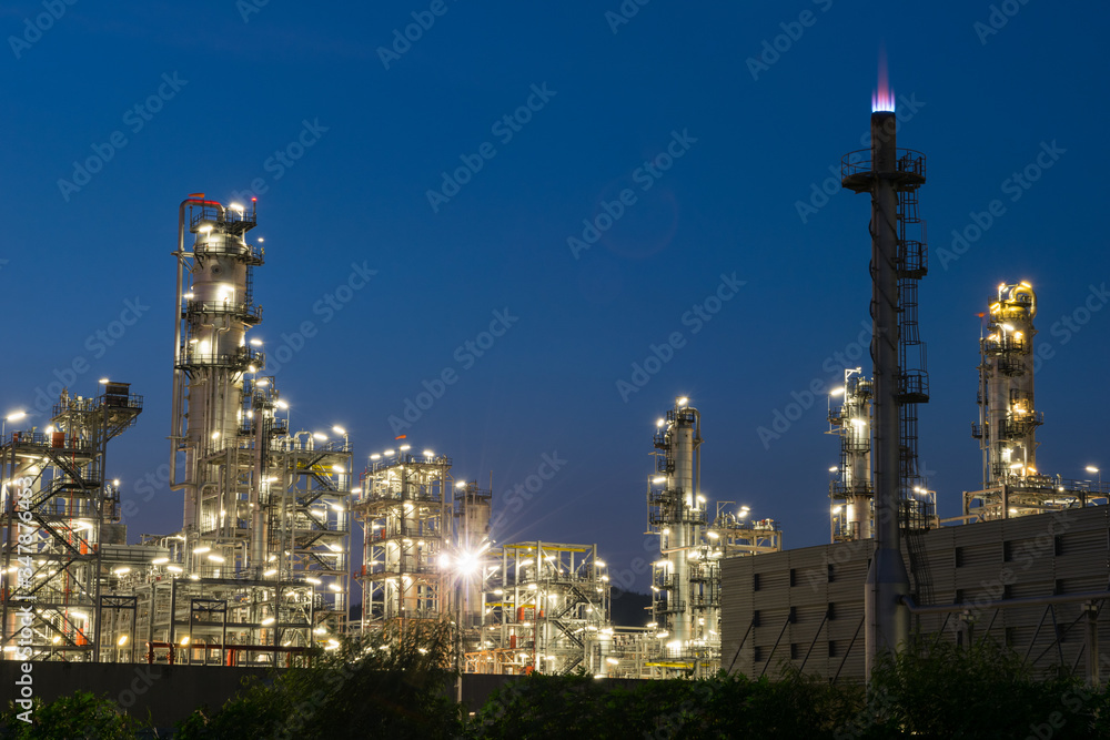 Oil refinery factory in twilight, petrochemical plant