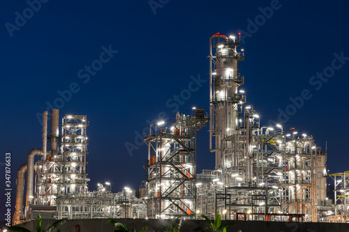 Closeup oil refinery factory in twilight, petrochemical plant
