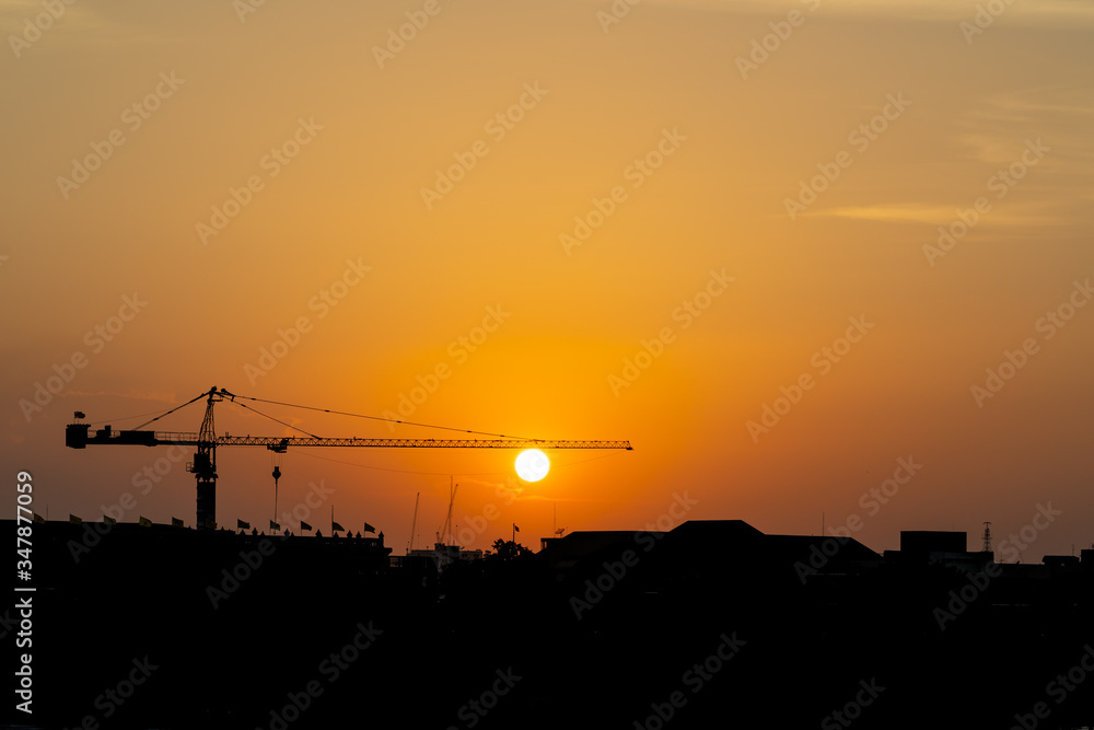 Silhouette of unde construction town when sun set shows travel scene