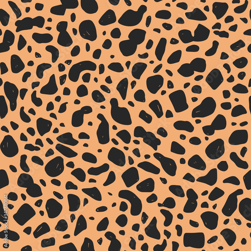 Cheetah hand-drawn seamless pattern. Animal print background