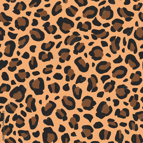 Leopard hand-drawn seamless pattern. Animal print background