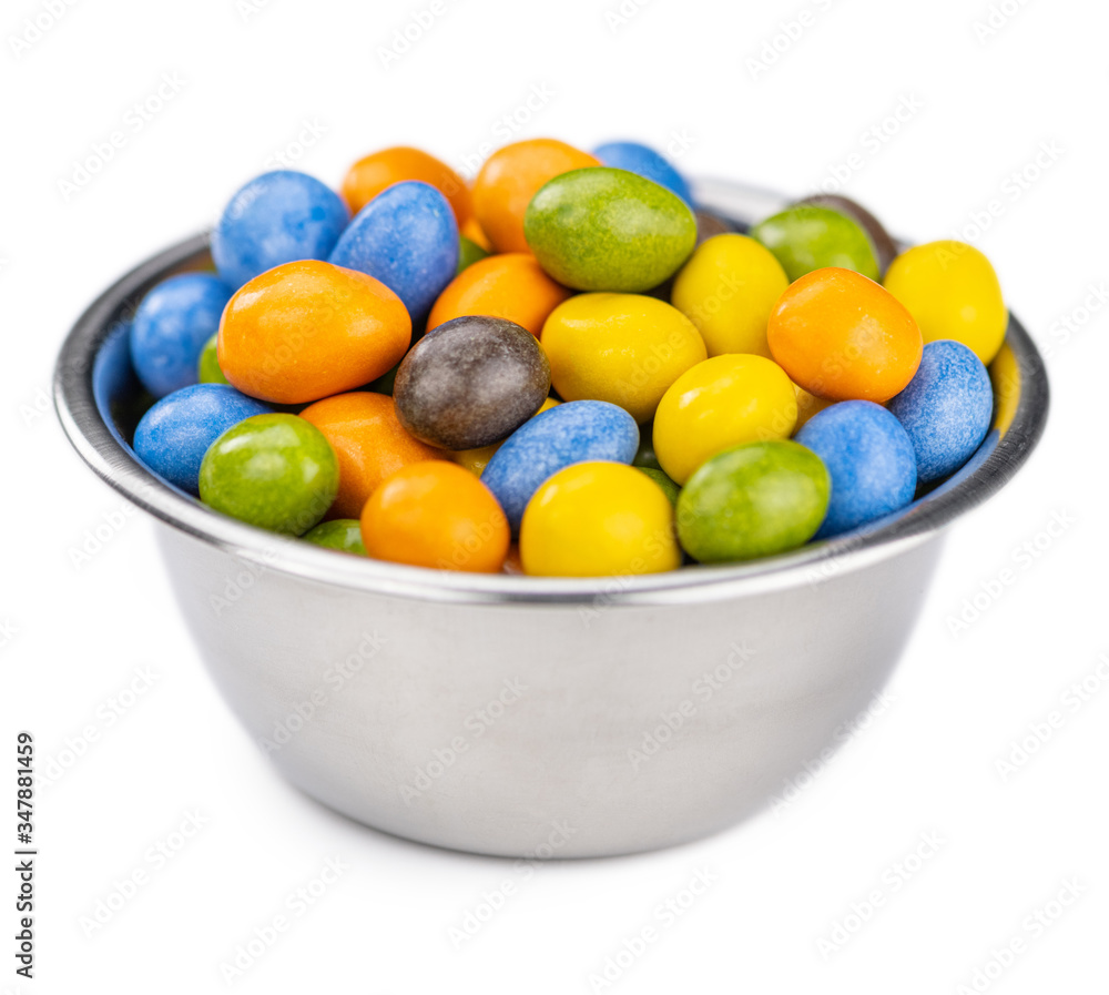 Chocolate coated peanuts isolated on white Chocolate coated peanuts isolated on white