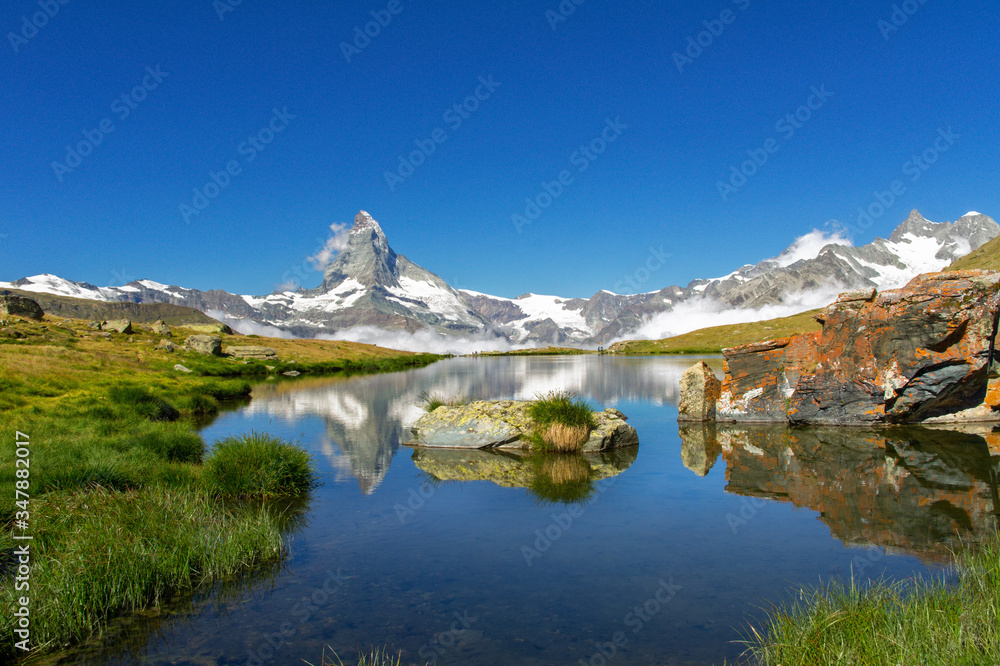 Beautiful Swiss Alps landscape with Stellisee lake and Matterhorn mountain reflection in water, summer mountains view, Zermatt, Switzerland
