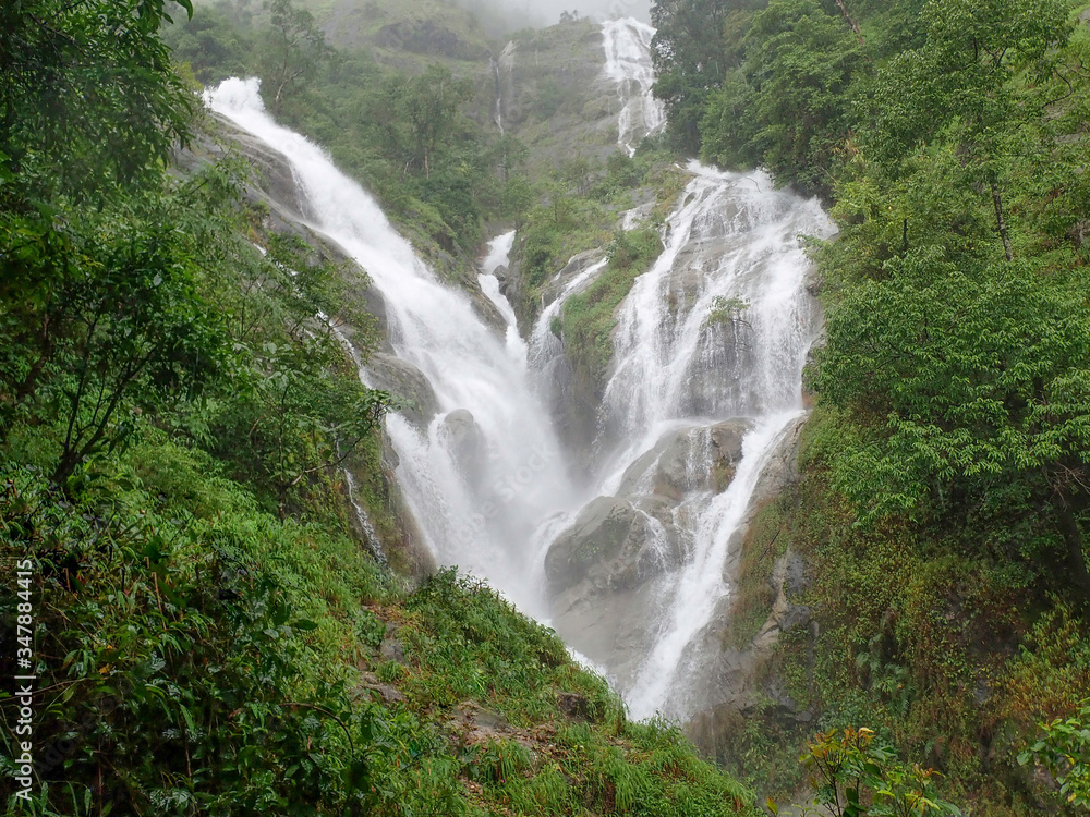 Heart shaped waterfall in the morning covered by morning mist after the rain stopped. Thailand Heart shaped waterfall in the morning covered by morning mist after the rain stopped. Thailand