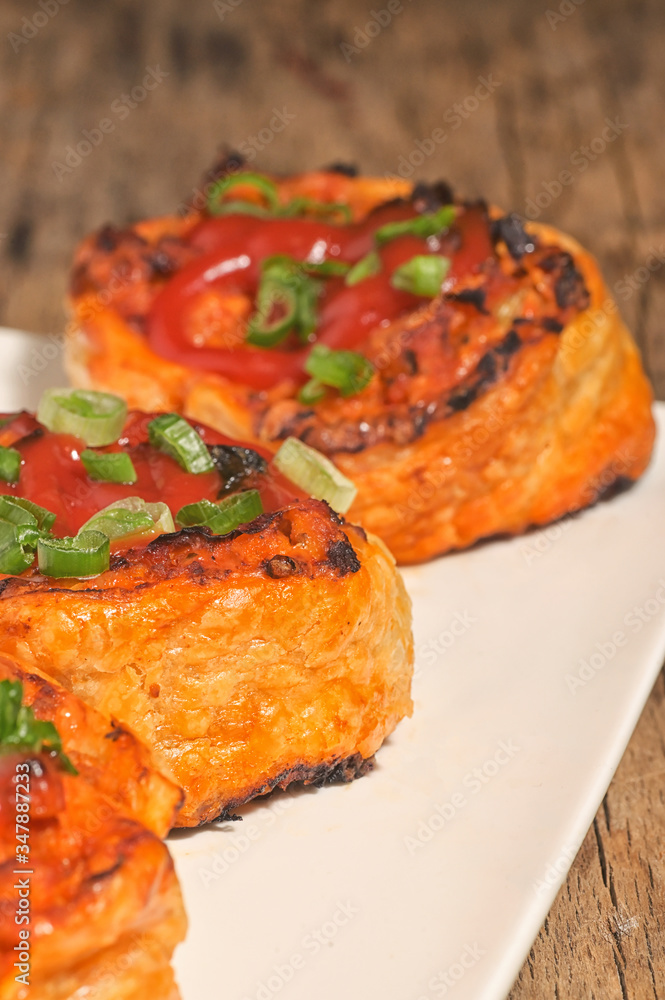 Filling Meat And Cheese Pastries on Plate Filling Meat And Cheese Pastries on Plate