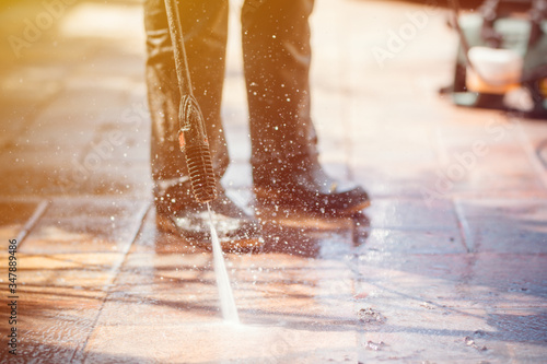 Outdoor floor cleaning with high pressure water jet