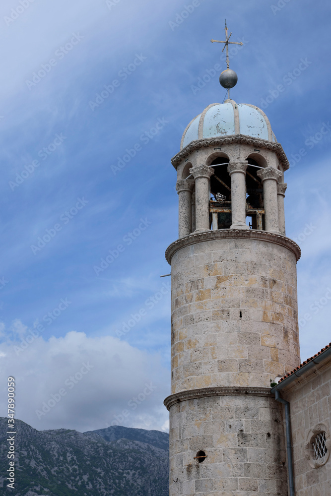 Fototapeta premium Tower of the Church of Our Lady of the Rock on the island of the same name, in the Bay of Kotor in the Adriatic, Montenegro, Europe.